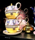 Tea pots with patterned design arranged in a shelf for sale