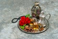 Tea and red rose flower, arabian lantern and rosary. Islamic holidays