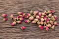 Tea rose flowers background. Dried buds of a pink tea rose closeup. Royalty Free Stock Photo