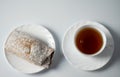 Tea on a saucer with sweet pastries Royalty Free Stock Photo
