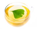 Ginkgo tea with a floating ginkgo leaf Royalty Free Stock Photo