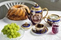 Tea service with marble cake and grapes Royalty Free Stock Photo