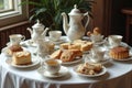 Tea Set with Assorted Sweets on Vintage Table Royalty Free Stock Photo