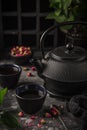 Tea set. Cast iron eastern tea pot, cups and dry rose Royalty Free Stock Photo