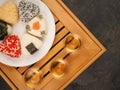 Tea set for the ceremony and Onigiri. Various shapes and fillings on a plate. Healthy snack. Japanese rice ball. Top view Royalty Free Stock Photo