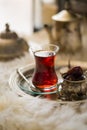 Tea set in oriental style in pear shaped glass with vintage kettle and dates fruit