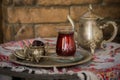 Tea set in oriental style in pear shaped glass with vintage kettle and dates fruit