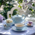 tea set in pastel blue and lavender with macarons, gentle sunlight, vintage table setup Royalty Free Stock Photo