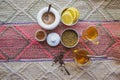 Tea and spices composition on a Peruvian rug.