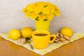 Tea with sugar and lemon, bagels and bouquet of flowers Royalty Free Stock Photo