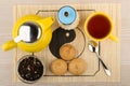 Tea with sugar, yellow glass kettle and biscuits Royalty Free Stock Photo