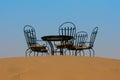 Tea table with chairs in sahara desert, Morocco Royalty Free Stock Photo