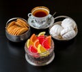 Tea time with candies and cookies. Royalty Free Stock Photo