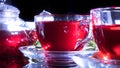 Tea time: cup of tea, carcade, karkade, rooibos. Red hot hibiscus tea in glass mug. Oriental, cozy, ceremony, tradition, japanese