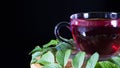 Tea time: cup of tea. Creative layout made of cup of hibiscus tea and tea leafs. Red tea, carcade, karkade, rooibos. Oriental, Royalty Free Stock Photo