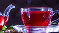 Tea time: cup of tea. Creative layout made of cup of hibiscus tea and tea leafs. Red tea, carcade, karkade, rooibos. Oriental, Royalty Free Stock Photo
