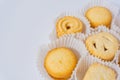 Danish butter cookies close up in the paper packing. Various butter biscuits with sugar on top Royalty Free Stock Photo