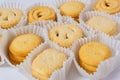 Danish butter cookies close up in the paper packing. Various butter biscuits with sugar on top Royalty Free Stock Photo