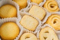 Danish butter cookies close up in the paper packing. Various butter biscuits with sugar on top Royalty Free Stock Photo