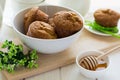 Tea time: homemade banana muffins, honey, bananas and tea settings Royalty Free Stock Photo