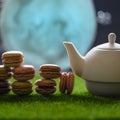 Tea time, oriental tales, teapot with French sweets, macaroons, starry sky and moon. Delicious and spicy tea with sweets, square