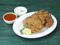 Tea time snack, Dal Vada or Parippu Vada or Paruppu Vadai , deep fried snacks savory food from south india served with coconut Royalty Free Stock Photo