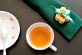 Tea time, top view of a tea cup with green napkin, biscuits, and Royalty Free Stock Photo