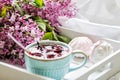 The tea to a karkada served in a gift box with marshmallows and a bouquet of a lilac. Close up. Royalty Free Stock Photo