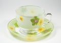 Tea transparent cup on a saucer with an ornament f