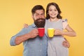 Tea for two. Happy family enjoy drinking tea together. Small daughter and father hold tea cups. Morning drink. Breakfast