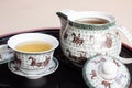 Tea water set for chinese tea style with white cup glass and white teapot on wood backplate Royalty Free Stock Photo