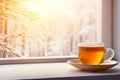 Tea by the winter window - a cozy home view, copy space