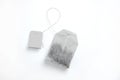 Teabag with grey label. Top view. Isolated on a white. mockup Royalty Free Stock Photo