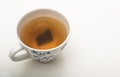 Teabag steeping in boiling water in a teacup Royalty Free Stock Photo