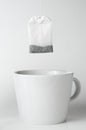 Teabag with white teacup Royalty Free Stock Photo