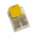 Teabag with yellow label.