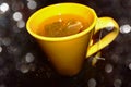 Teabag in a yellow tea cup with filter effect