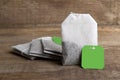 Teabags on wooden background