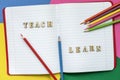 Teach and learn, words in open notebook, colorful crayons and colored paper sheets. Concept of education, starting Royalty Free Stock Photo