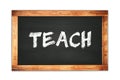 TEACH text written on wooden frame school blackboard