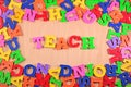 Teach written by plastic colorful letters