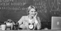 Teacher with alarm clock at blackboard. Time. Study and education. Modern school. Knowledge day. woman in classroom Royalty Free Stock Photo