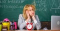 Teacher with alarm clock at blackboard. Time. woman in classroom. Back to school. Teachers day. Study and education Royalty Free Stock Photo