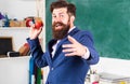 Teacher with an apple. Excited man professor wearing formal suit with funny expression emotions funny face. Royalty Free Stock Photo