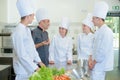 teacher and apprentices - kitchen humor Royalty Free Stock Photo