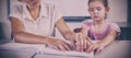 Teacher assisting blind student in library Royalty Free Stock Photo