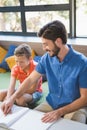 Teacher assisting blind student in library Royalty Free Stock Photo