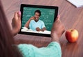 Teacher assisting student through video conferencing Royalty Free Stock Photo