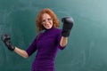 Teacher in boxing gloves celebrating her winning Royalty Free Stock Photo