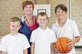 Teacher With Boys School Basketball Team Royalty Free Stock Photo